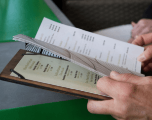 picture of a man reading a menu - (StockSnap Pixabay)